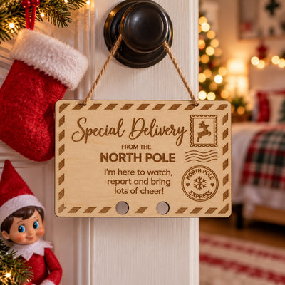 Wooden North Pole special delivery sign displayed on a door