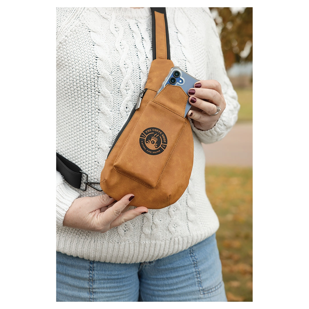Personalized compact leather sling bag in camel with custom business name engraving