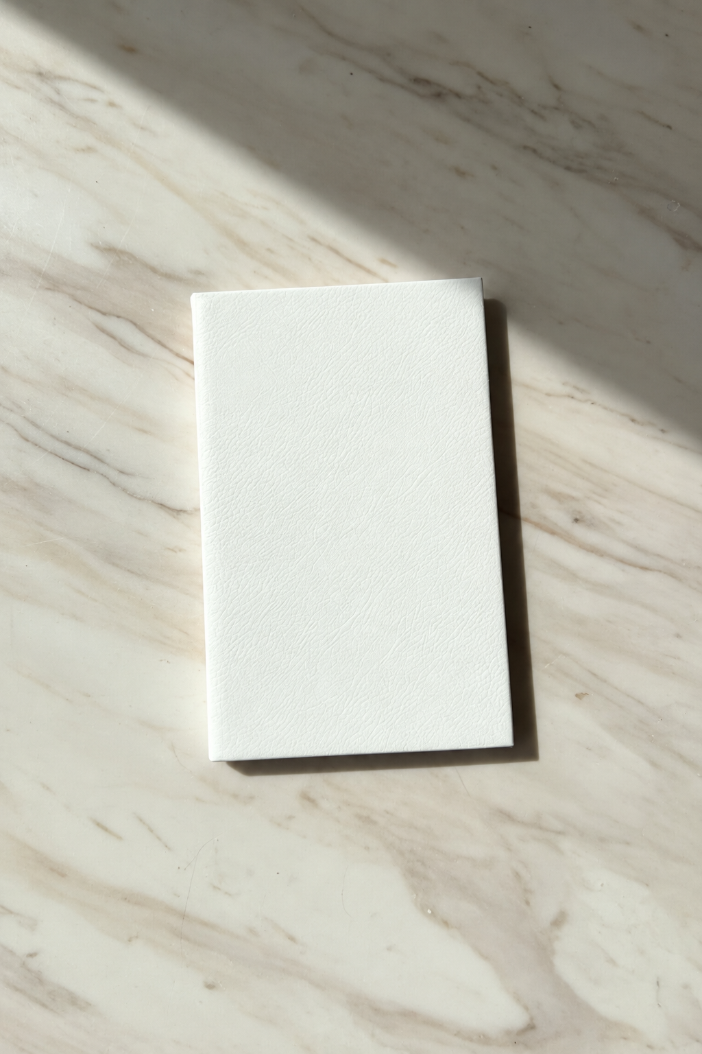 Blank white leatherette journal ready for personalization