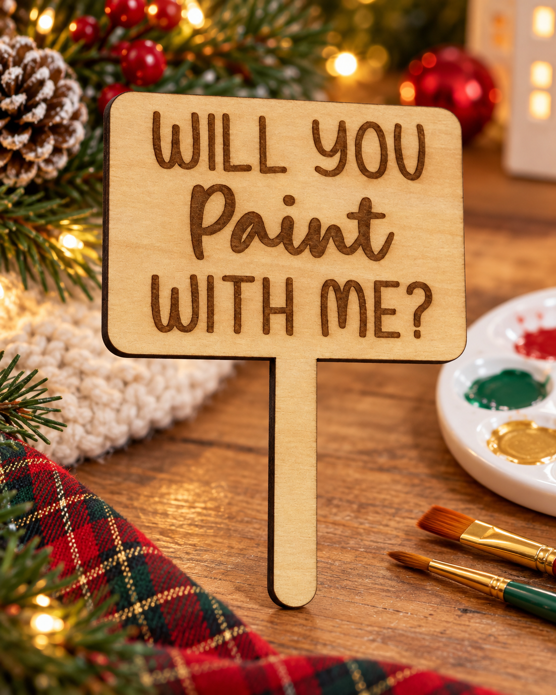 Festive lifestyle concept of laser-cut wooden Christmas Helper prop; original product photograph shows exact engraving and shape