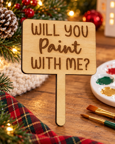 Festive lifestyle concept of laser-cut wooden Christmas Helper prop; original product photograph shows exact engraving and shape