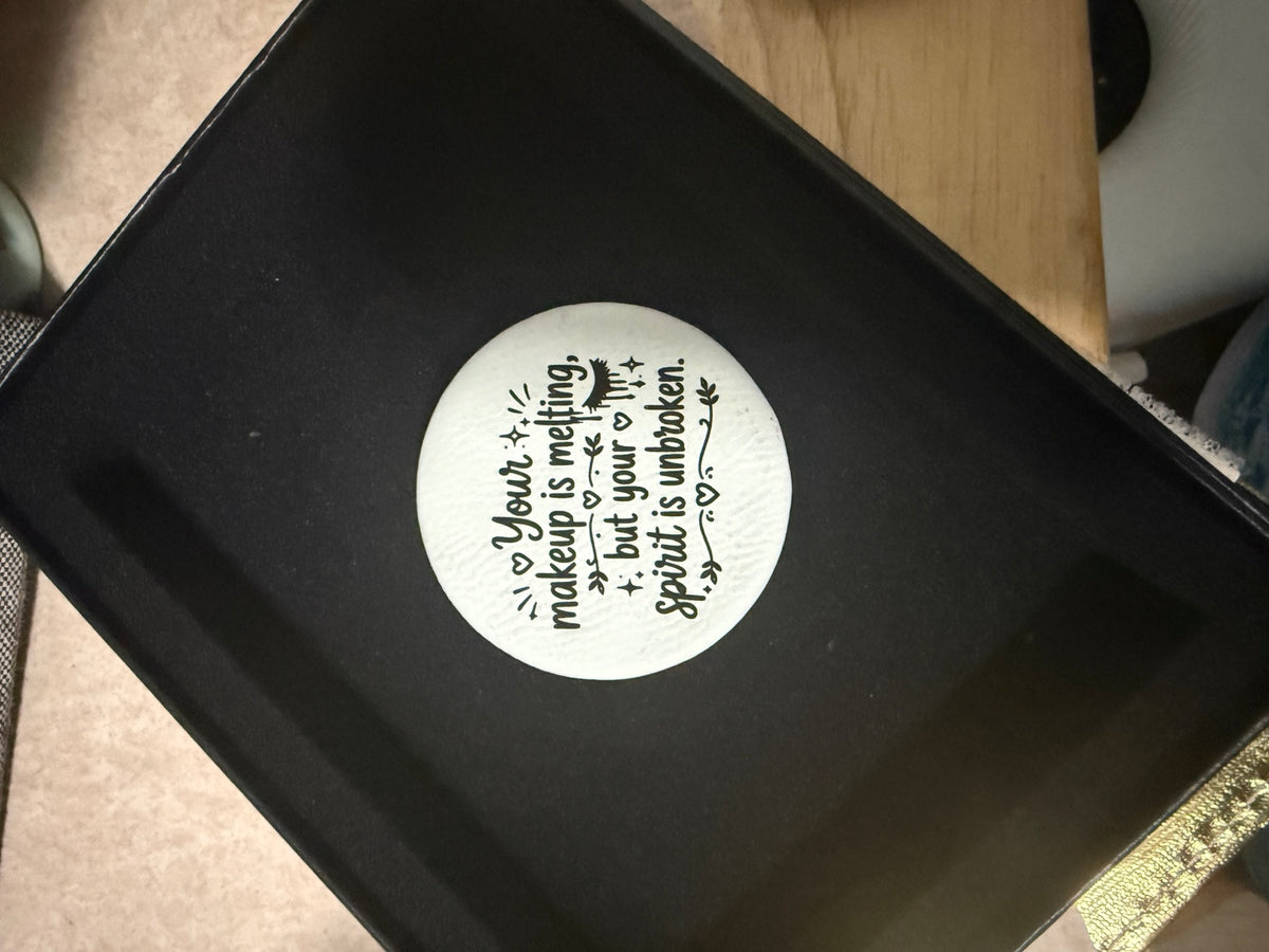 Round engraved compact mirror that reads Your makeup is melting but your spirit is unbroken