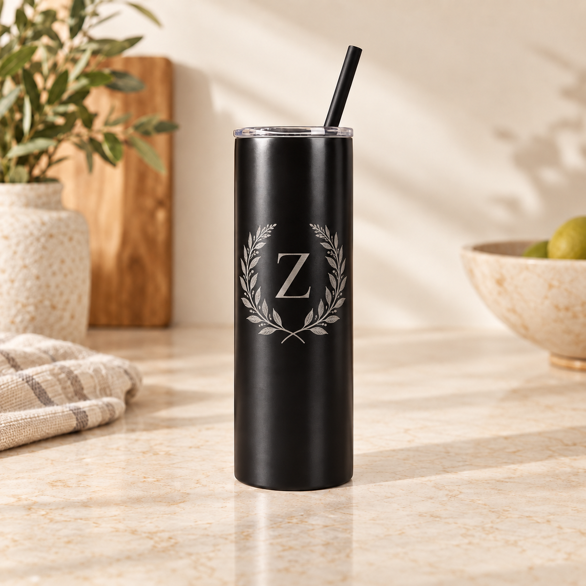 Black 20 oz laser-engraved tumbler with botanical Z monogram